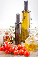 Image showing tatsty geen olives tomatoes and olive oil 