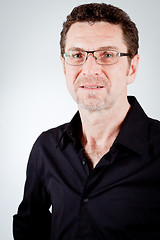 Image showing attractive adult man with glasses and black shirt