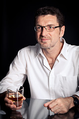 Image showing adult man holding an alcoholic drink