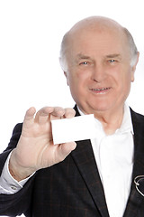 Image showing Smiling senior businessman presenting his card