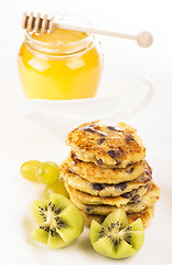 Image showing Delightful cheese pancakes with a kiwi and grapes