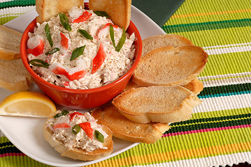 Image showing Bowl of crab dip with toasted crostini and lemon