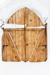 Image showing wooden door in a snow palace
