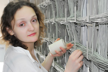 Image showing Woman working on telecommunication equipment