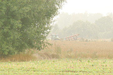 Image showing agriculture tractor plow field tree morrning fog 