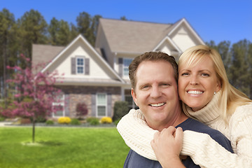 Image showing Happy Couple Hugging in Front of House