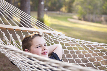 Image showing Young Boy Enjoying A Day in His Hammock