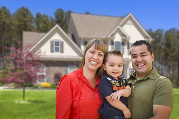 Image showing Mixed Race Young Family in Front of House