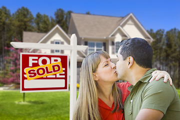 Image showing Couple in Front of Real Estate Sign and House