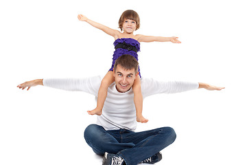Image showing Handsome father with his little daughter on his shoulders happil