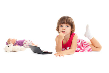 Image showing Little beautiful girl is playing with make-up