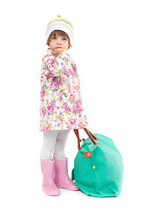 Image showing Pretty little girl in autumn clothes with a big bag. Studio port