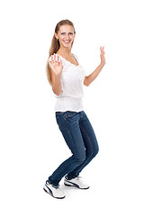 Image showing beautiful girl dancing on a white background