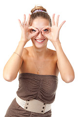 Image showing Beautiful girl hamming and shows glasses hands