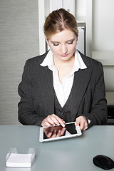 Image showing Businesswoman working on a tablet