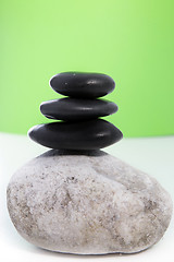 Image showing Three black stones stacked on top of each other