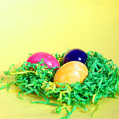 Image showing Colourful Easter Eggs on straw