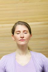 Image showing Woman meditating with closed eyes