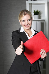 Image showing Beautiful office worker giving thumbs up