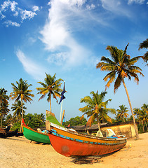 Image showing old fishing boats on beach in india