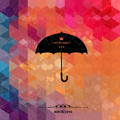 Image showing Retro umbrella on colorful geometric background with grunge paper.