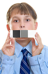 Image showing Photo test shot with  color checker.   Child holding a qp card