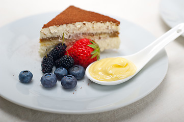 Image showing tiramisu dessert with berries and cream