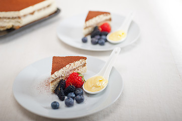 Image showing tiramisu dessert with berries and cream