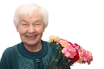 Image showing Old woman with flowers