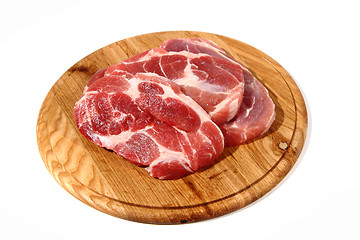 Image showing raw meat steak on the wooden board 