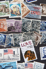 Image showing used postage stamps collection background