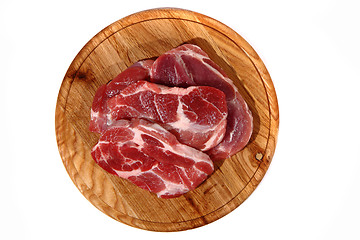 Image showing raw meat steak on the wooden board 