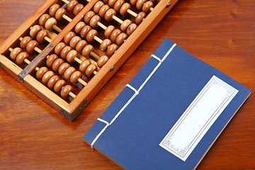 Image showing chinese book and abacus