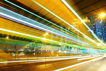 Image showing moving car with blur light through city at night