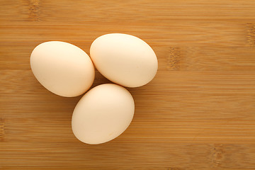 Image showing Fresh egg on wood table