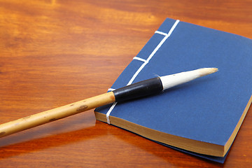 Image showing chinese book and writing brush