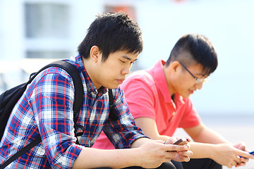 Image showing two friend using phone