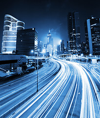 Image showing traffic light through city at night