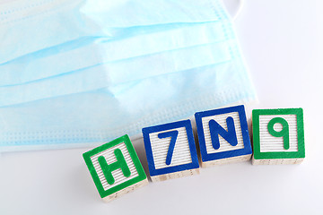 Image showing H7N9 alphabet block with protective face mask