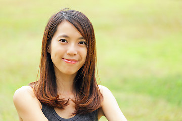 Image showing young woman smiling friendly