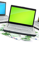 Image showing Open laptop with money 