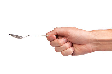 Image showing Hand is holding a spoon isolated