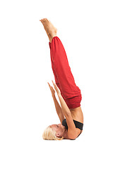 Image showing Practicing Yoga. Young woman isolated on white background