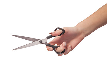 Image showing Hand is holding scissors isolated