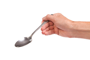 Image showing Hand is holding a spoon isolated