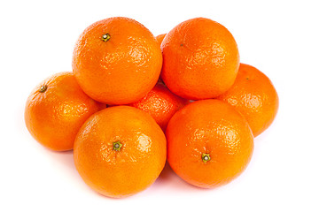 Image showing Group of ripe tangerine or mandarin with slices on white