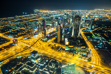 Image showing Dubai downtown night scene with city lights,