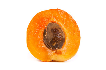 Image showing Two ripe apricot sectioned by knife