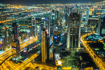 Image showing Dubai downtown night scene with city lights,