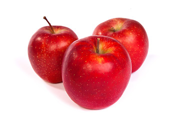 Image showing Three shiny red apples isolated on white